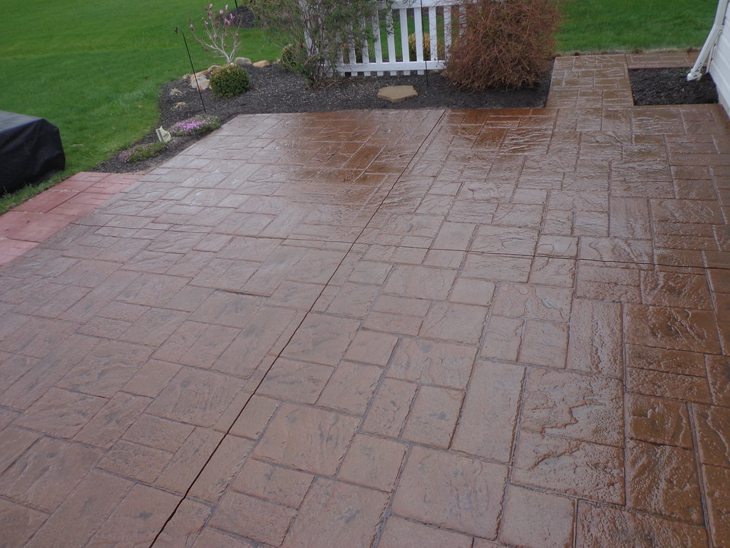 Stamped concrete patio finished in a brick-look pattern