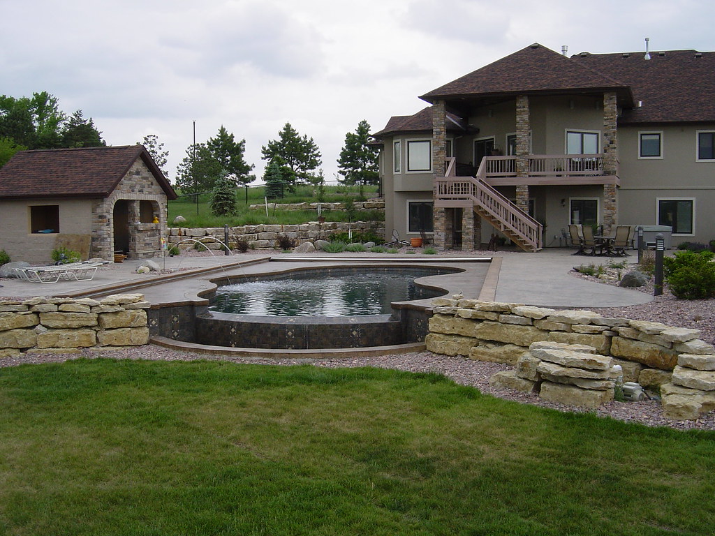 Outdoor living area with stone retaining walls