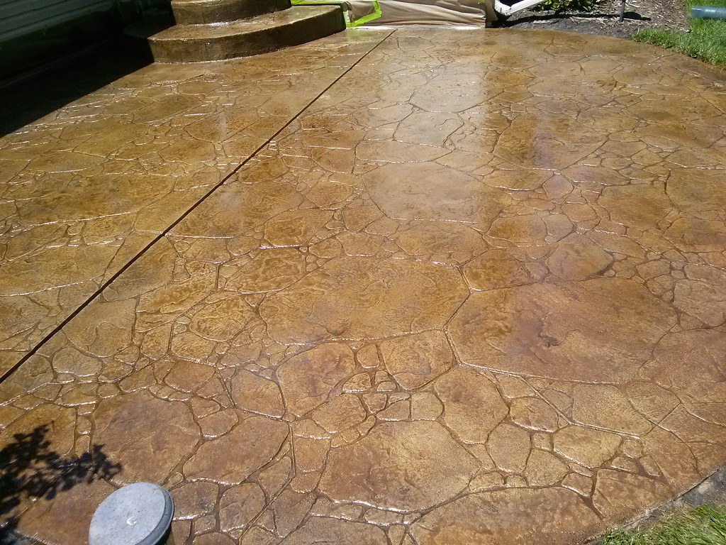 Freshly stamped and stained concrete patio finish