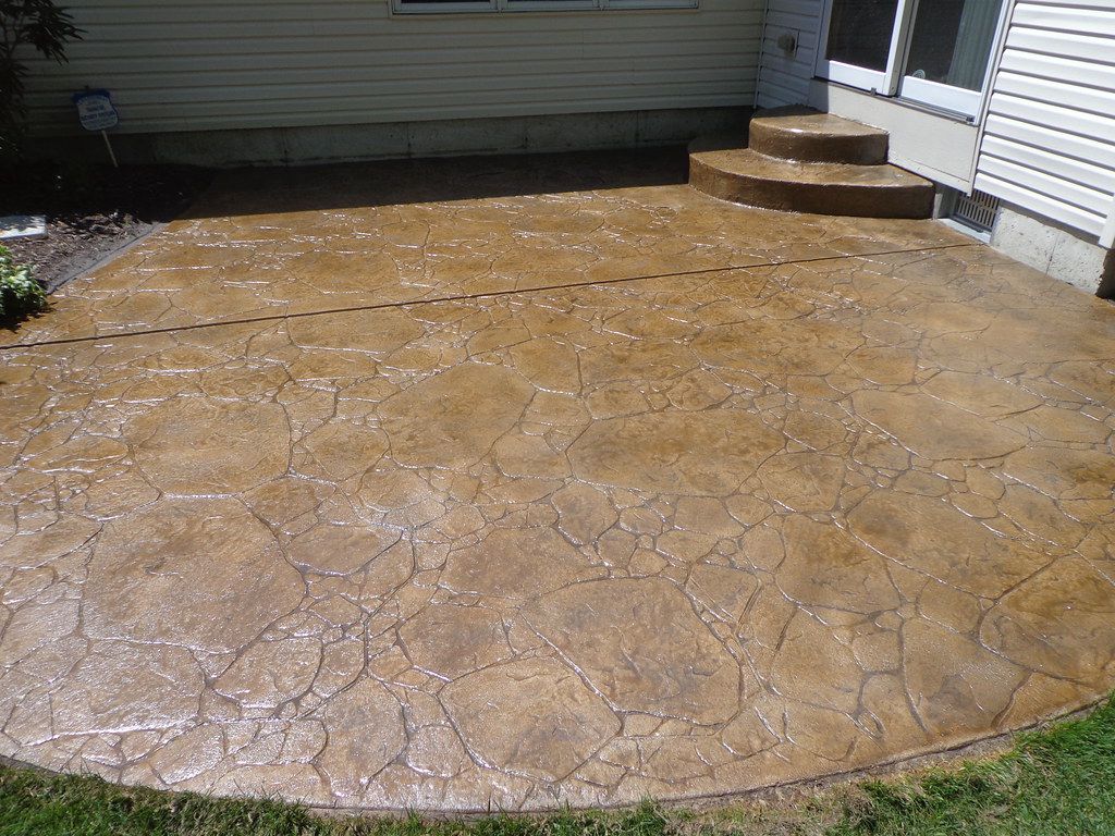 Coloured concrete patio finished with matching steps